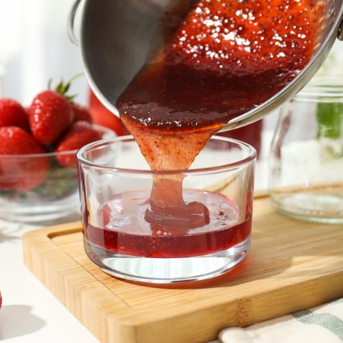Concept of cooking tasty and sweet food - strawberry jam