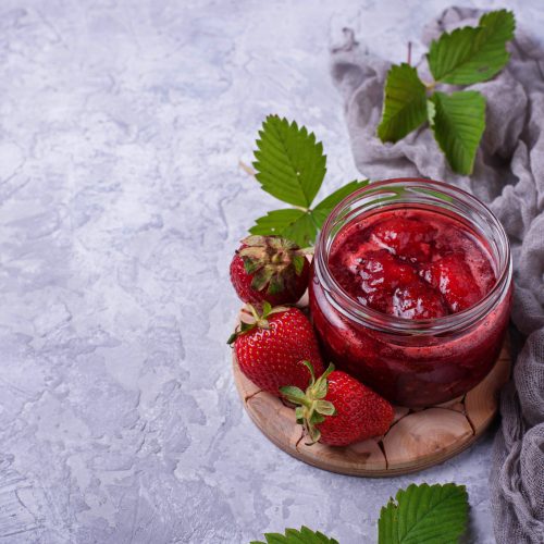 Strawberry jam in jar. Selective focus